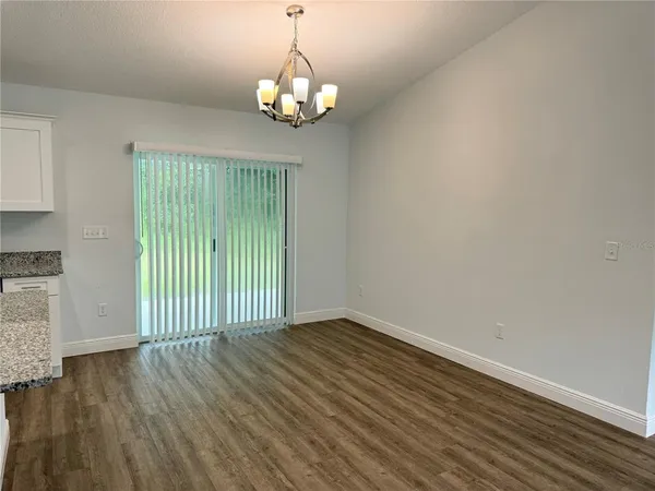 a view of a livingroom with wooden floor