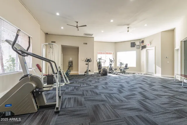 a view of a livingroom with furniture and windows