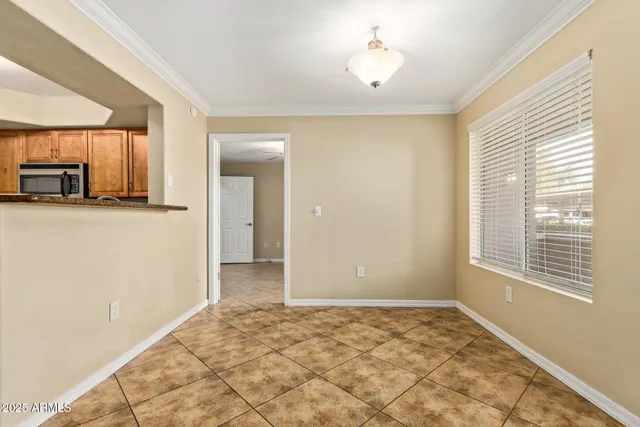 a view of a kitchen with a sink and a window