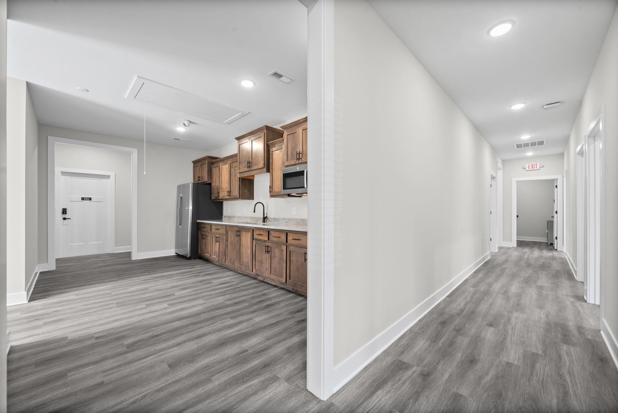 2510 Pea Ridge Road Clarksville, TN 37040 - Photo 25 of 41 a view of a big room with wooden floor and a kitchen