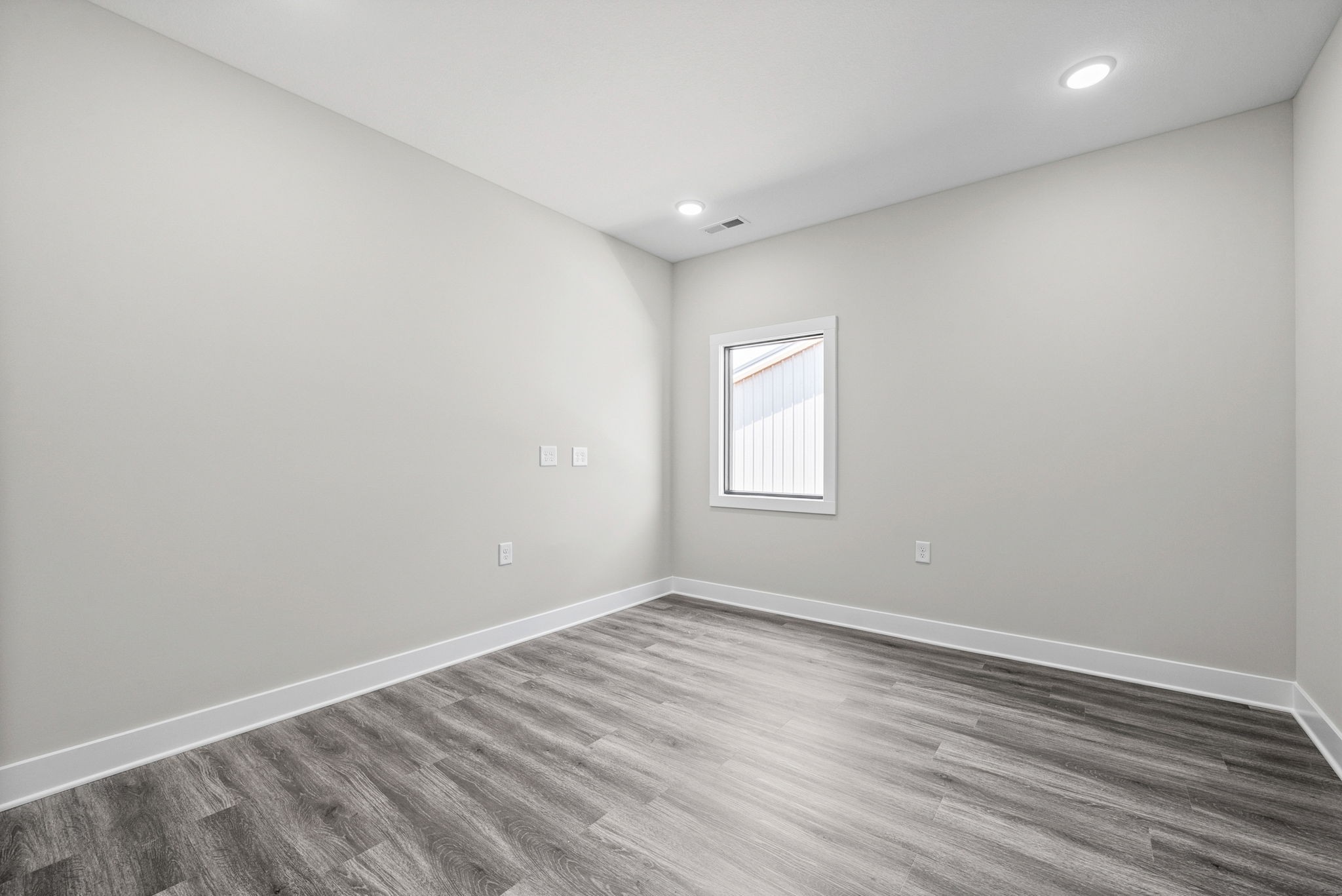 2510 Pea Ridge Road Clarksville, TN 37040 - Photo 31 of 41 an empty room with wooden floor and windows