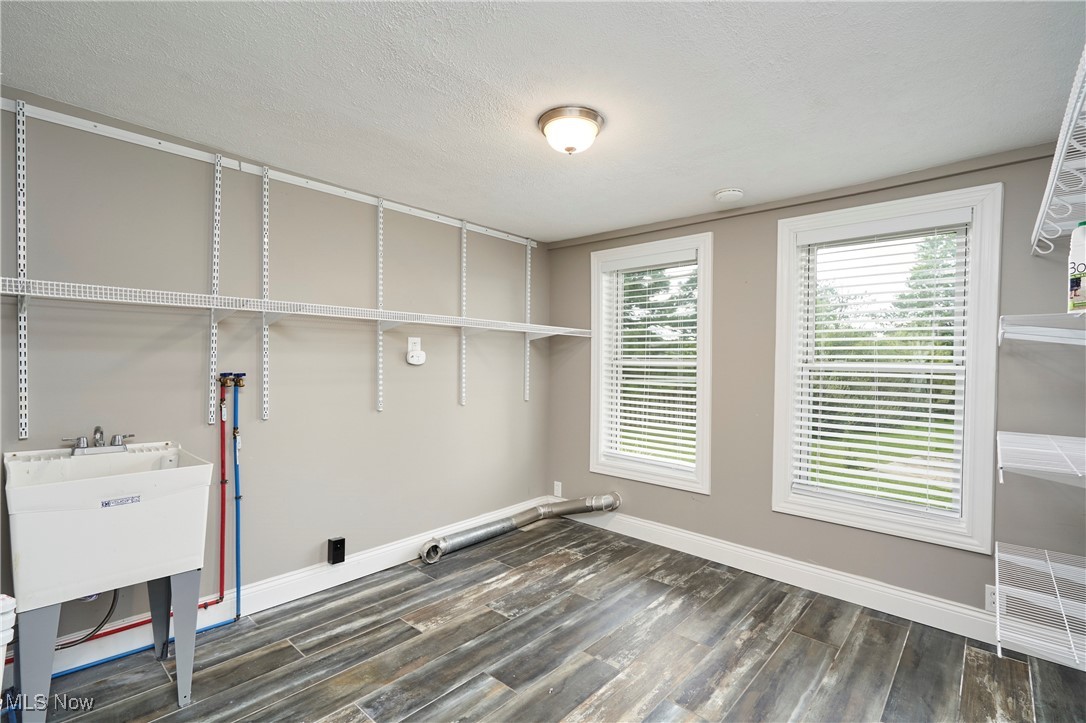 4226 Broadview Road Richfield, OH 44286 - Photo 19 of 24 Washroom with a textured ceiling and dark wood-style flooring