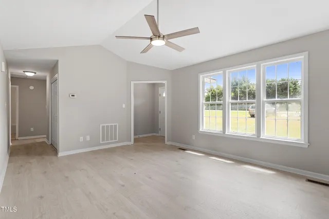 a view of an empty room with a window