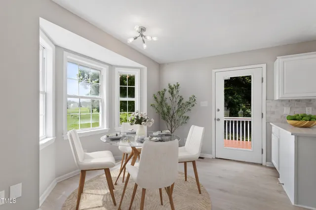 a view of a dining room with furniture window and outside view