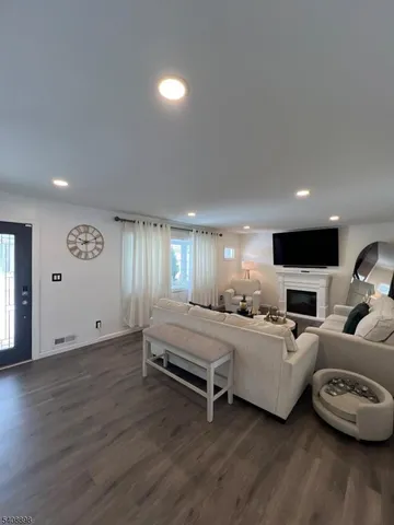 a spacious bedroom with bed and a large window