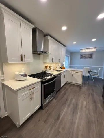 a kitchen with a sink and a stove top oven