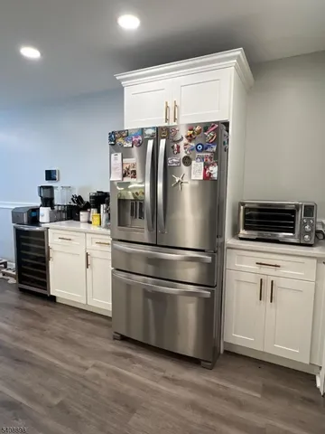a kitchen with stainless steel appliances a refrigerator stove and microwave