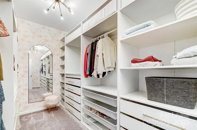 a view of a swimming pool with an outdoor space and seating area