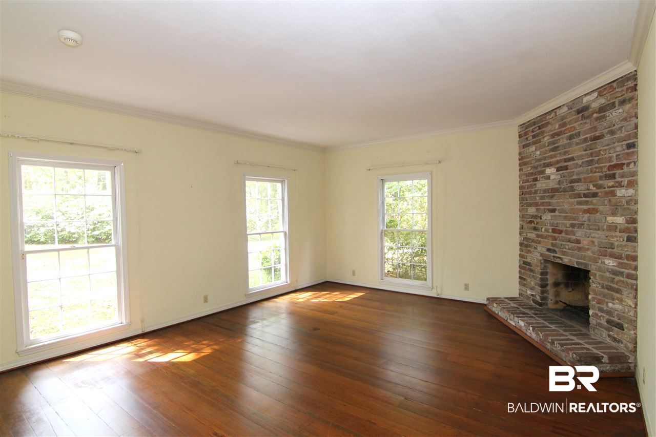 7147 Chapman Street Fairhope, AL 36532 - Photo 4 of 48 Fireplace & hardwood floors