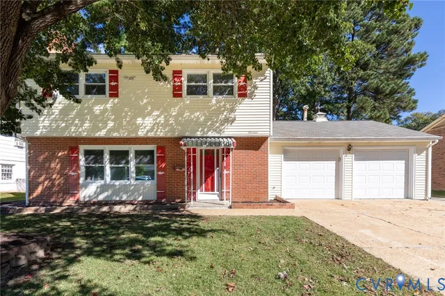 front view of a house with a yard