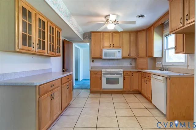 a kitchen with stainless steel appliances granite countertop a stove and a sink