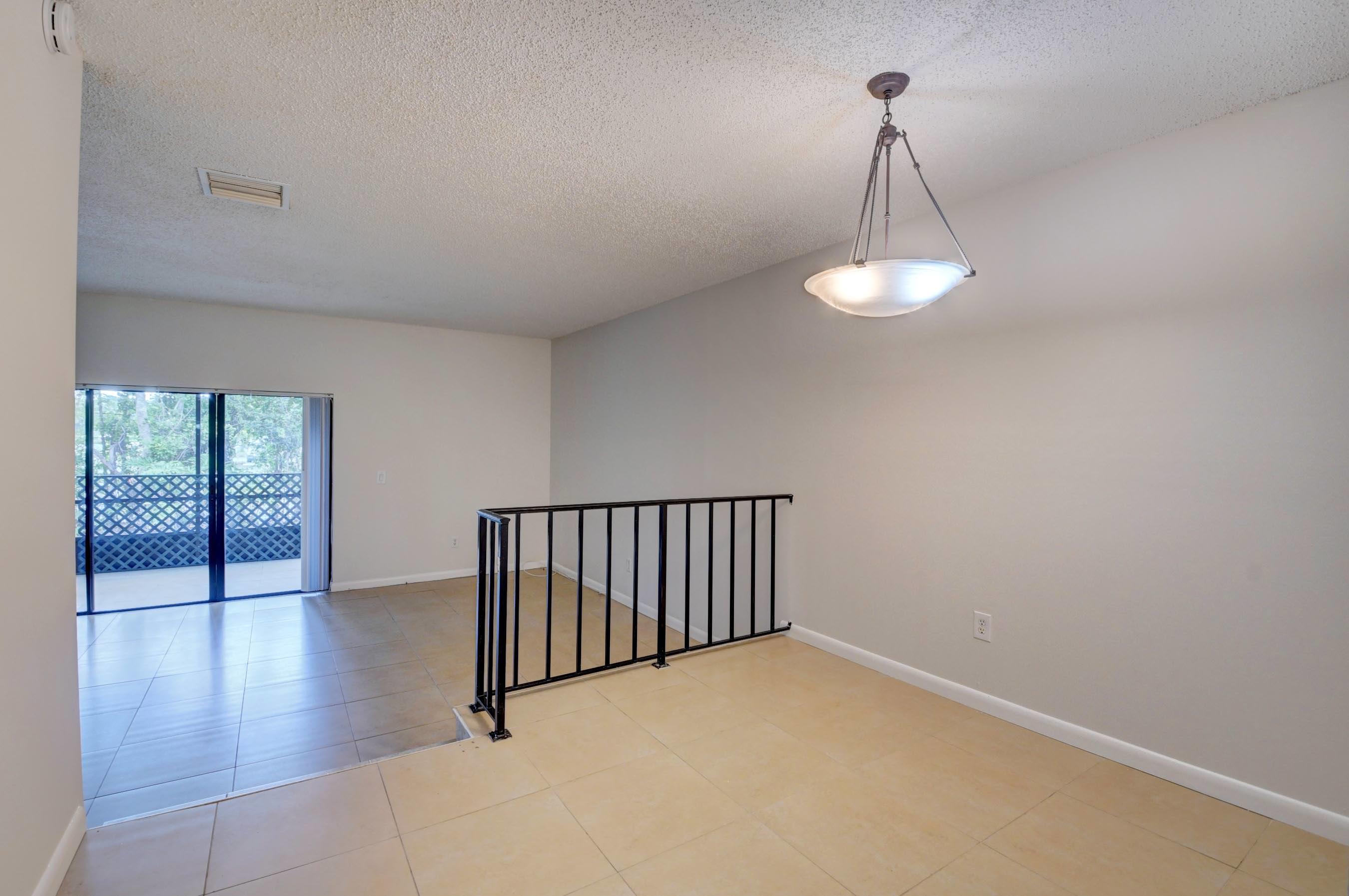 21748 Juego Circle, Unit 21E Boca Raton, FL 33433 - Photo 28 of 56 DR to sunken LR