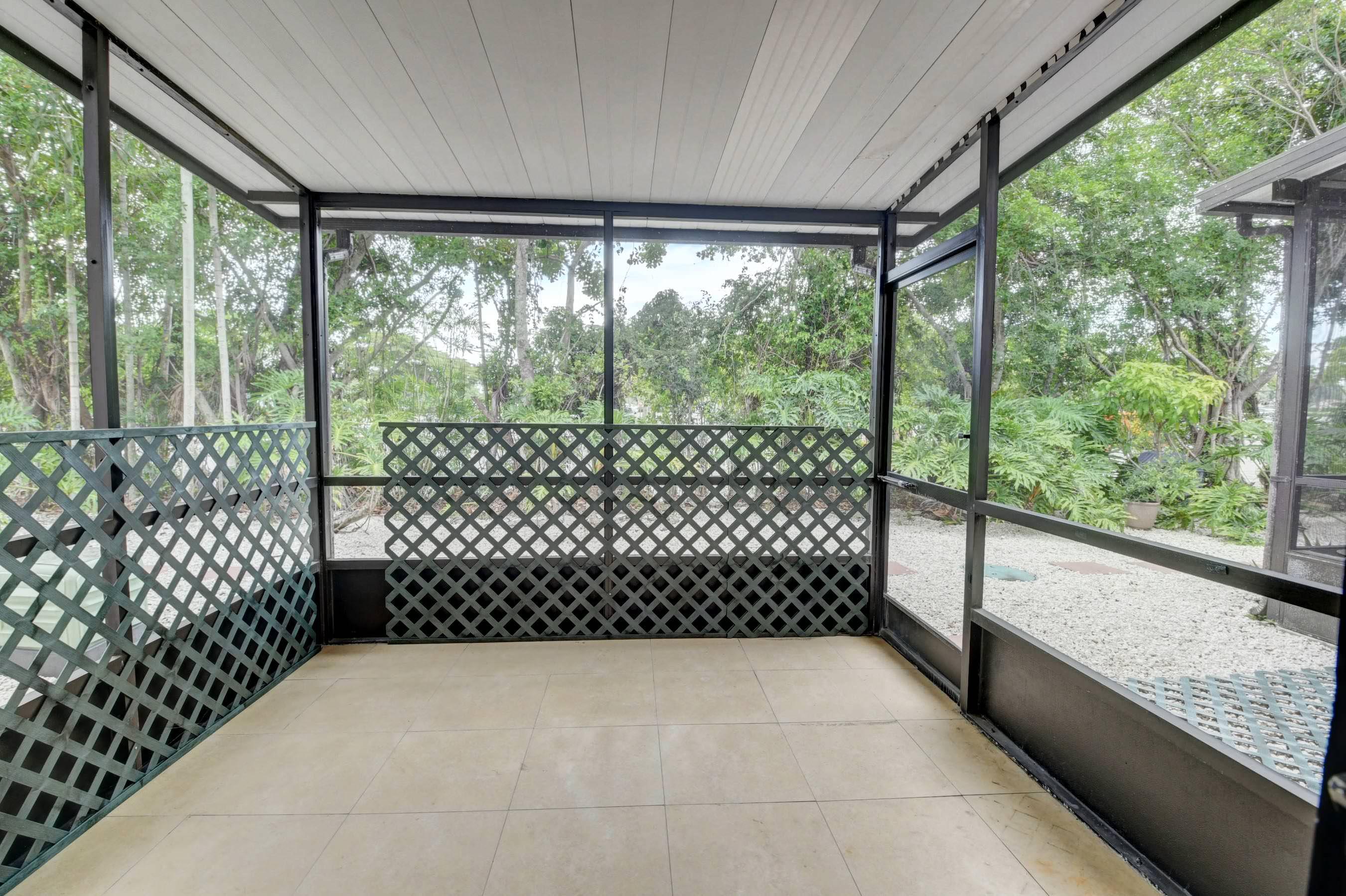 21748 Juego Circle, Unit 21E Boca Raton, FL 33433 - Photo 35 of 56 Roofed, screened patio