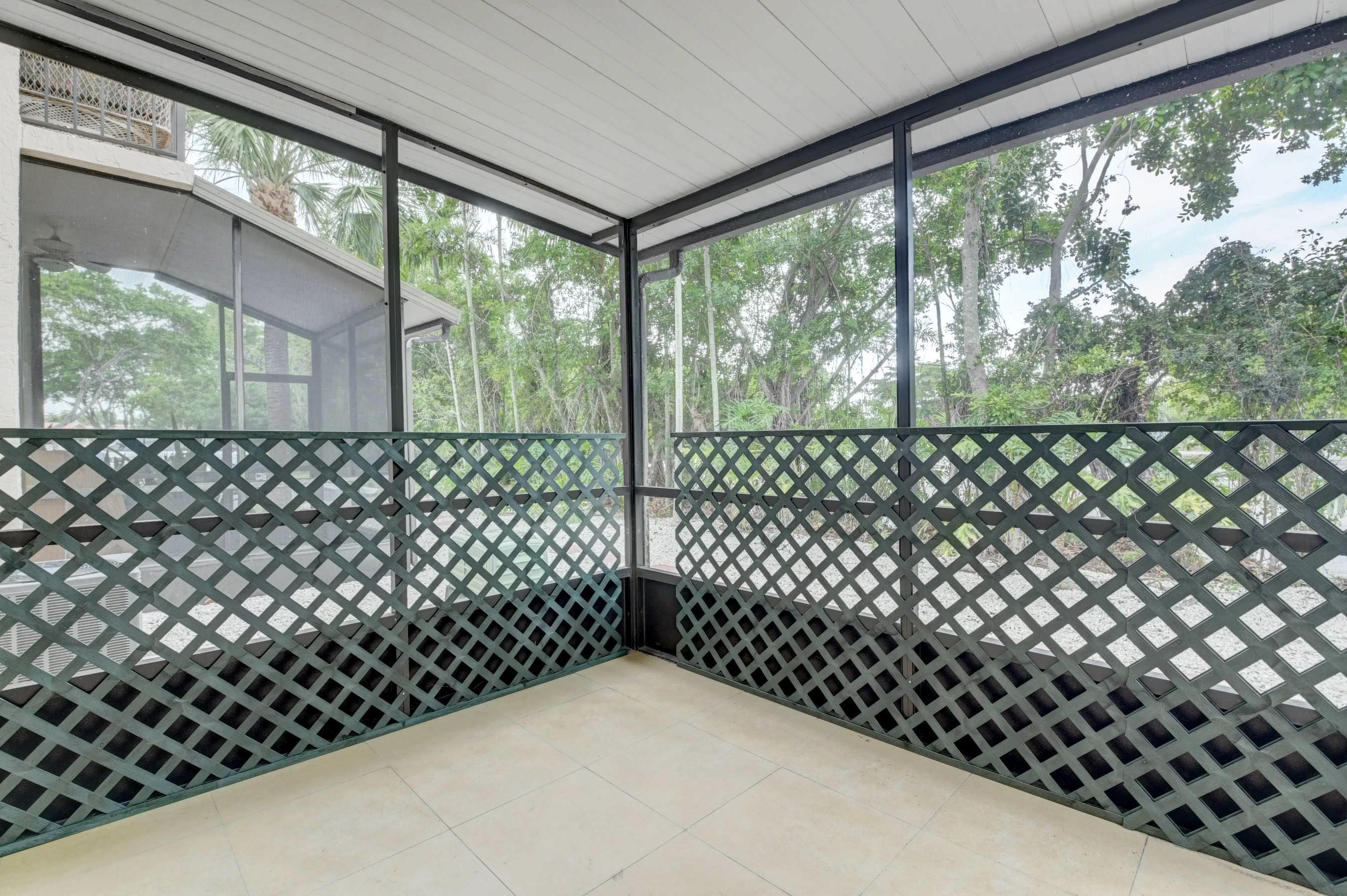 21748 Juego Circle, Unit 21E Boca Raton, FL 33433 - Photo 37 of 56 a view of a black gate