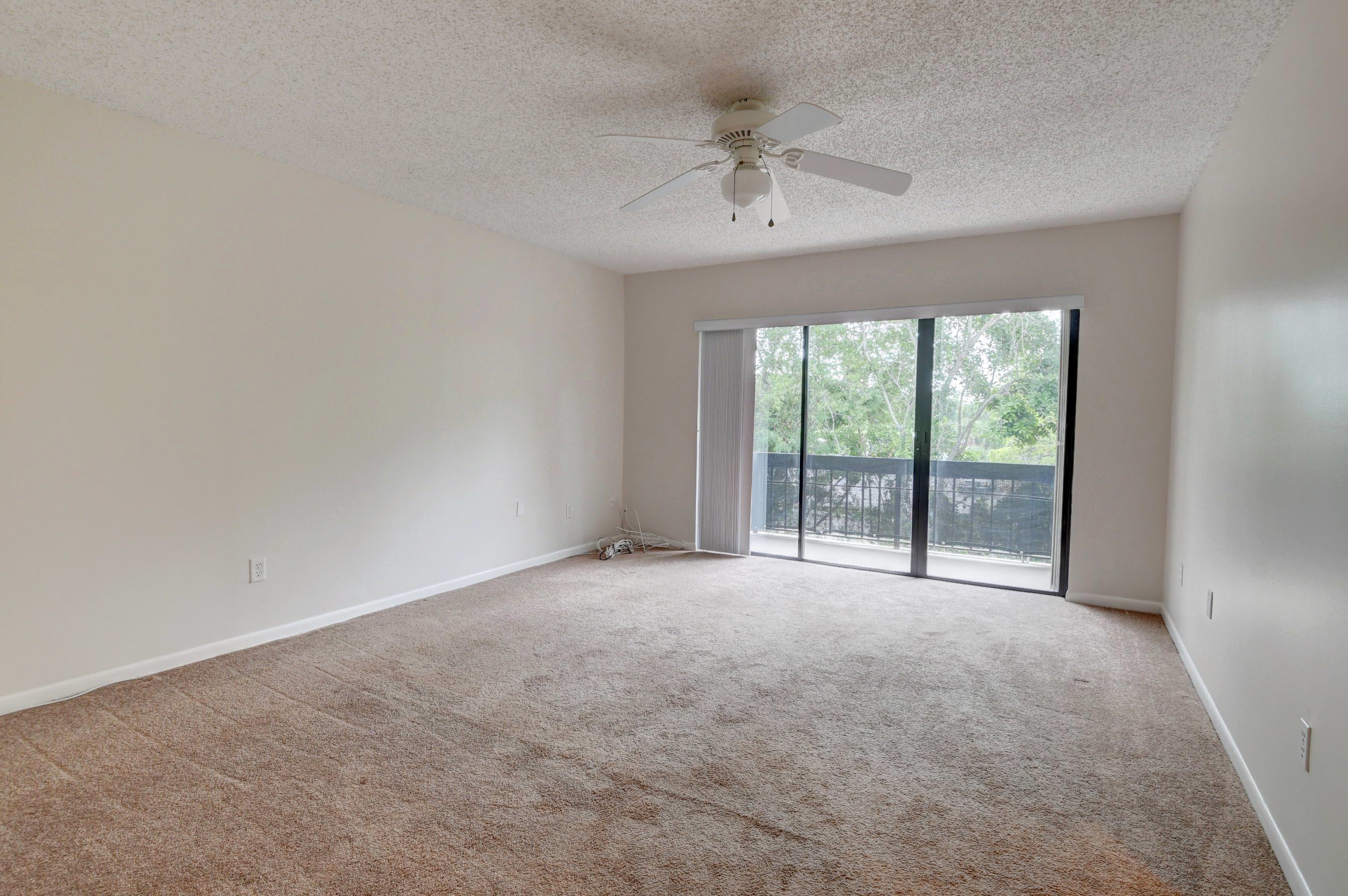 21748 Juego Circle, Unit 21E Boca Raton, FL 33433 - Photo 43 of 56 a view of an empty room with a window