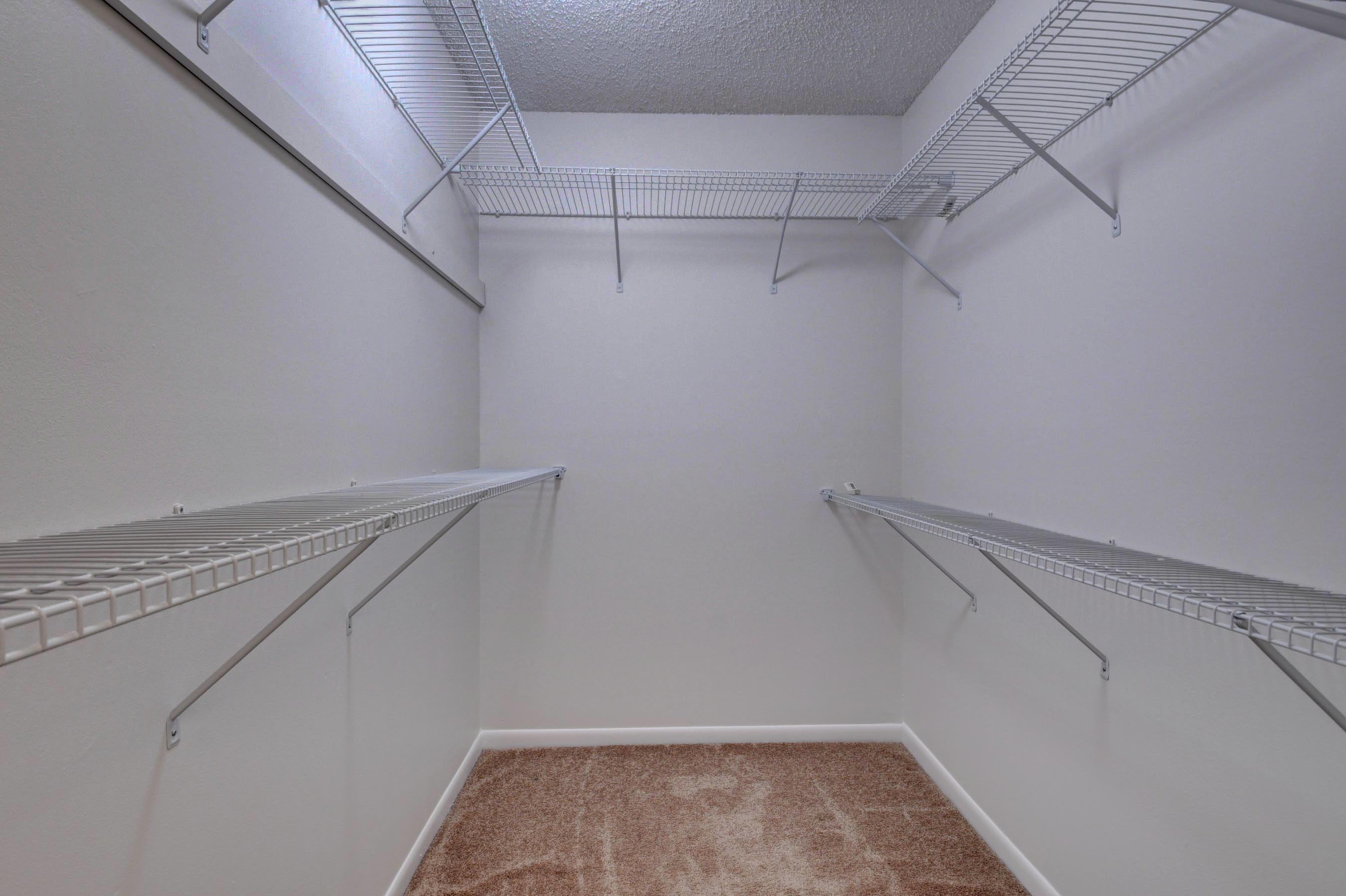 21748 Juego Circle, Unit 21E Boca Raton, FL 33433 - Photo 48 of 56 a view of a room with racks on the wall