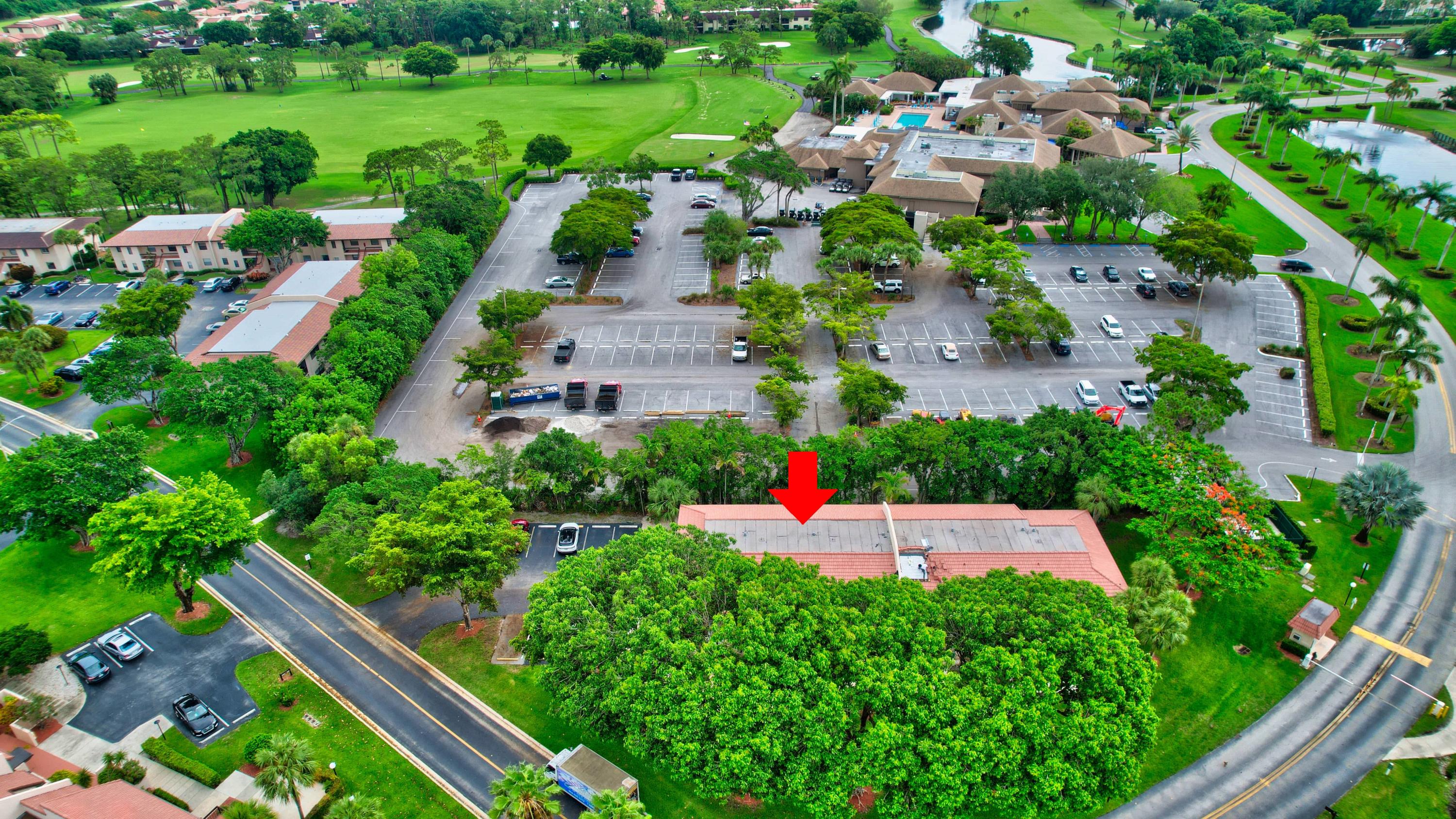 21748 Juego Circle, Unit 21E Boca Raton, FL 33433 - Photo 9 of 56 an aerial view of a house with swimming pool a yard and lake view