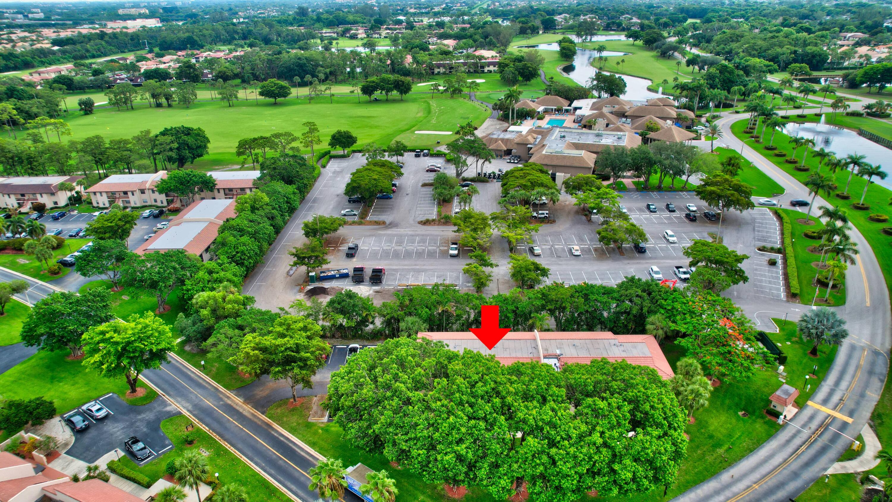 21748 Juego Circle, Unit 21E Boca Raton, FL 33433 - Photo 10 of 56 a view of a garden with plants and flowers