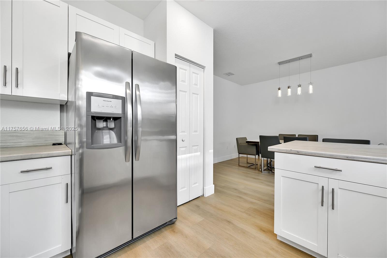 4671 Santa Cruz Way, Unit 4671 Davie, FL 33314 - Photo 12 of 20 a view of a refrigerator in kitchen and a sink