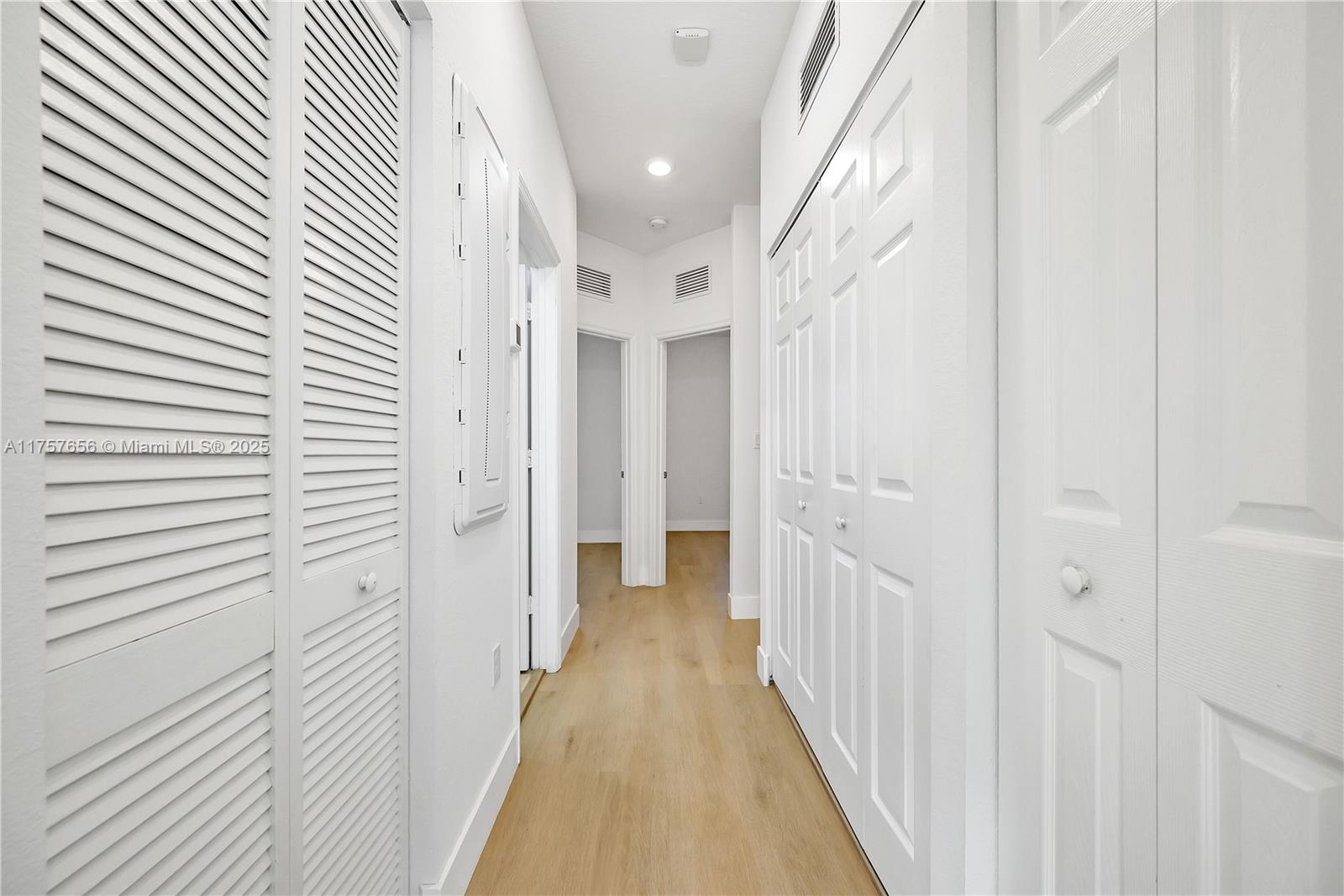4671 Santa Cruz Way, Unit 4671 Davie, FL 33314 - Photo 18 of 20 a view of a hallway with a white wooden cabinets