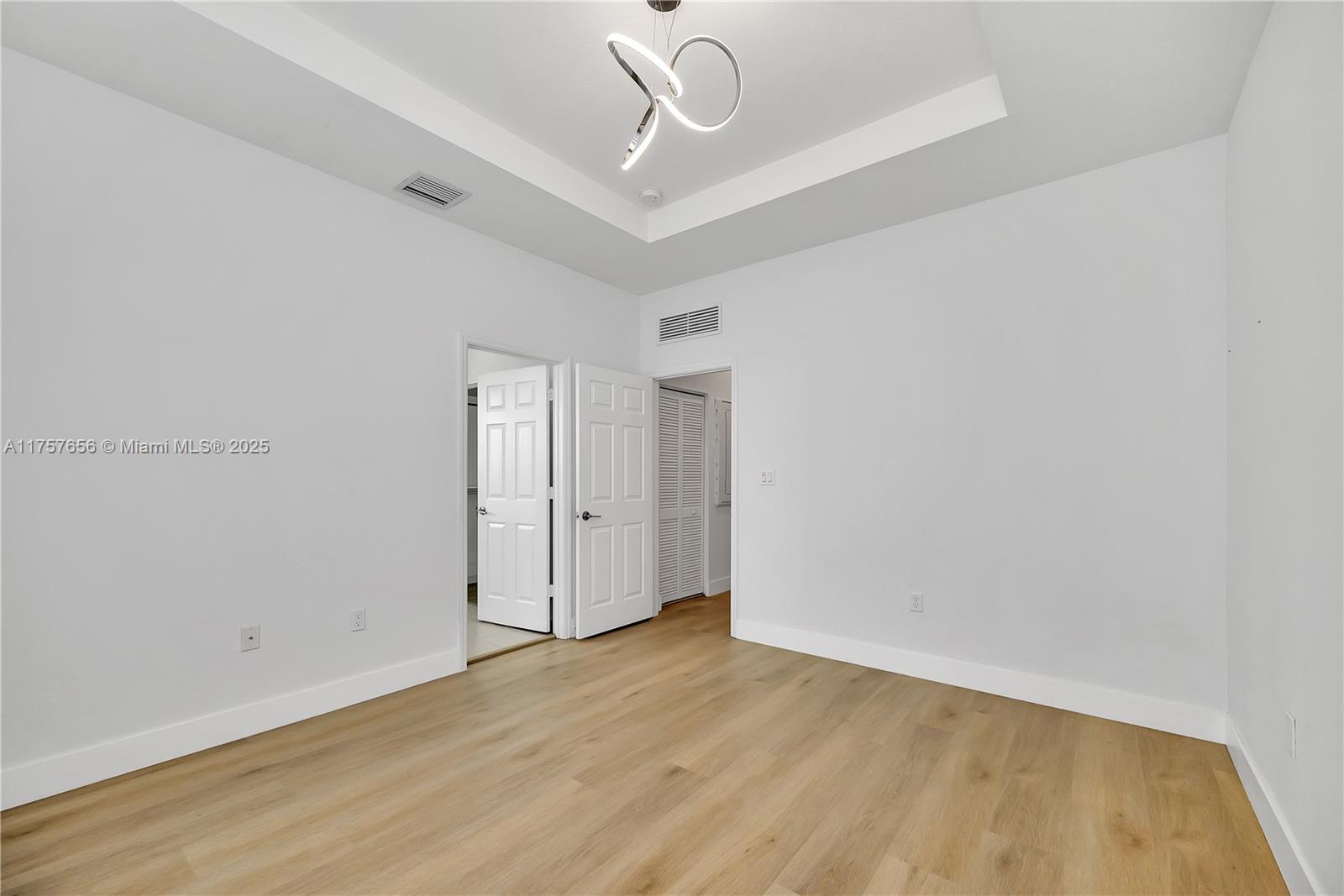 4671 Santa Cruz Way, Unit 4671 Davie, FL 33314 - Photo 20 of 20 a view of an empty room with wooden floor