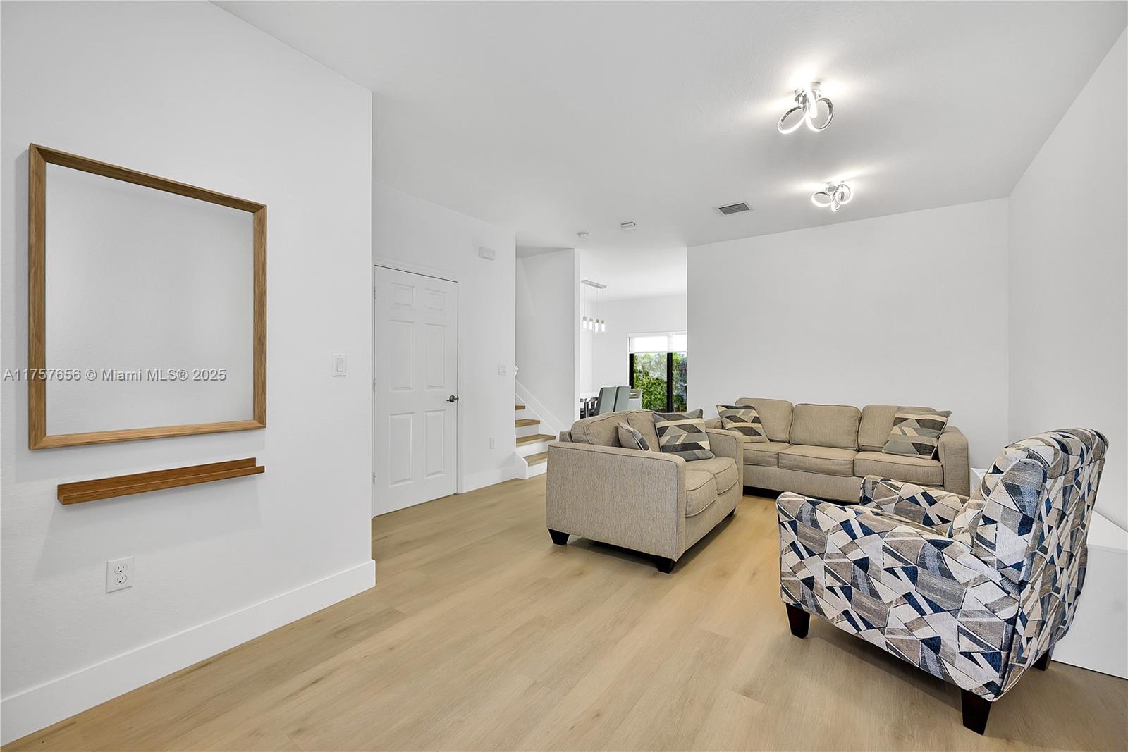 4671 Santa Cruz Way, Unit 4671 Davie, FL 33314 - Photo 4 of 20 a living room with furniture and wooden floor