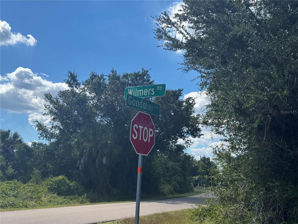 54 Wilmers Road Punta Gorda, FL 33982 - Photo 7 of 7 a sign that is on a pole