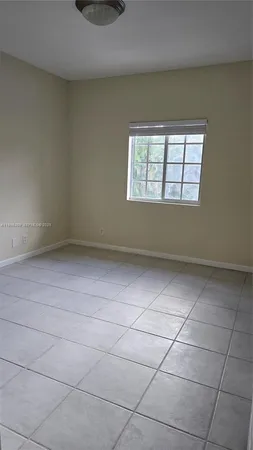 a open kitchen with cabinets and a stove top oven