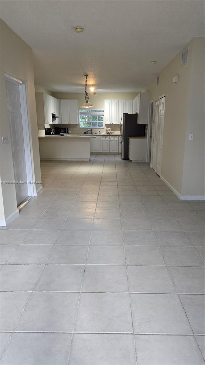 Hillcrest Hollywood, FL 33021 - Photo 6 of 6 a open kitchen with cabinets and a stove top oven