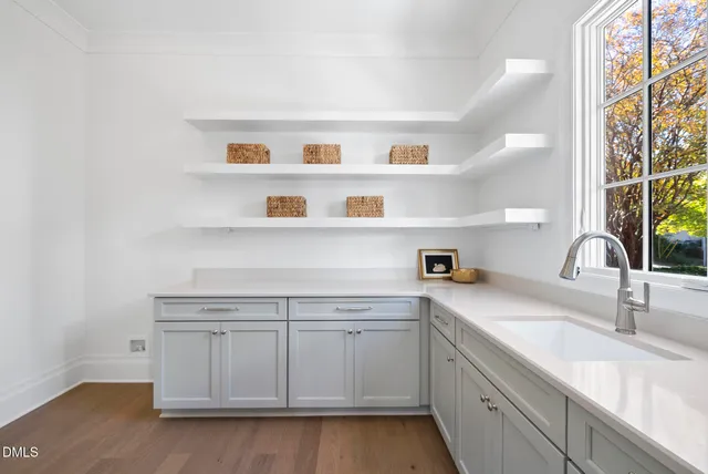 a kitchen with a sink and a window