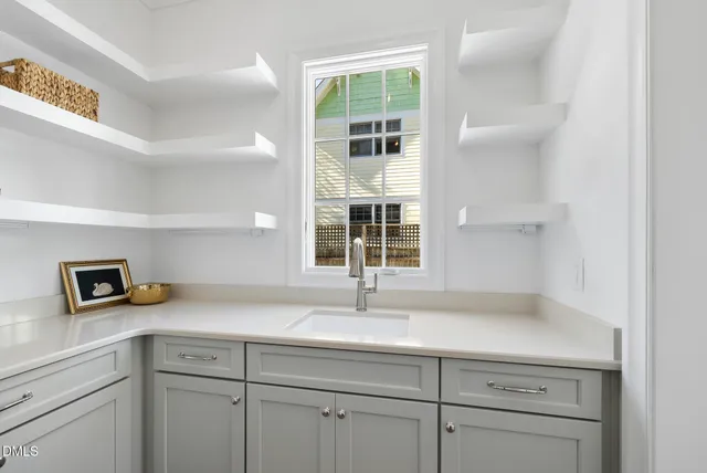 a dining room with furniture a chandelier and wooden floor