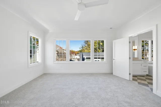 a spacious bathroom with a sink mirror and a bathtub