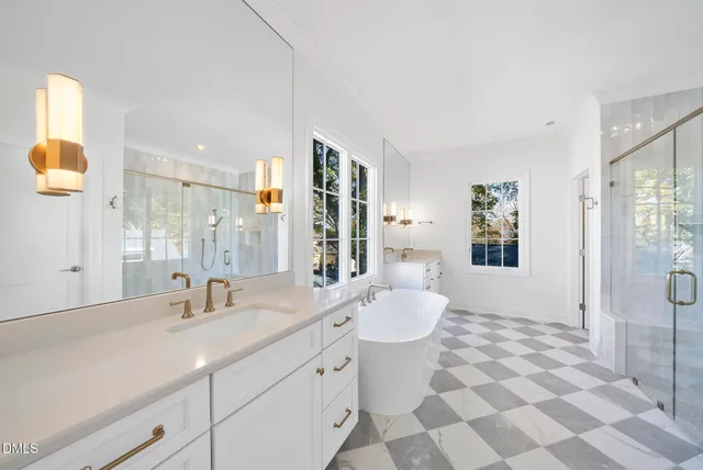 a bathroom with a bathtub and a shower