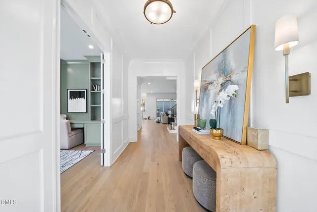 a spacious bathroom with a granite countertop double vanity sink and a mirror