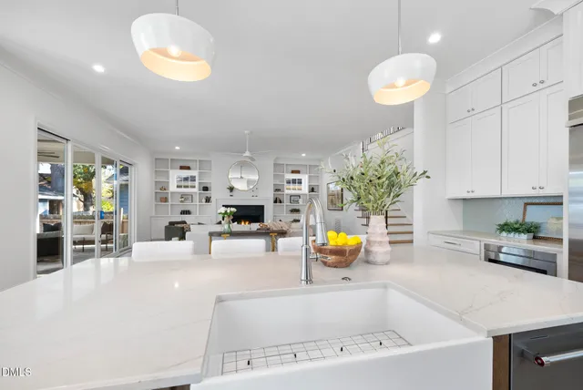 a kitchen with granite countertop a stove and a cabinet