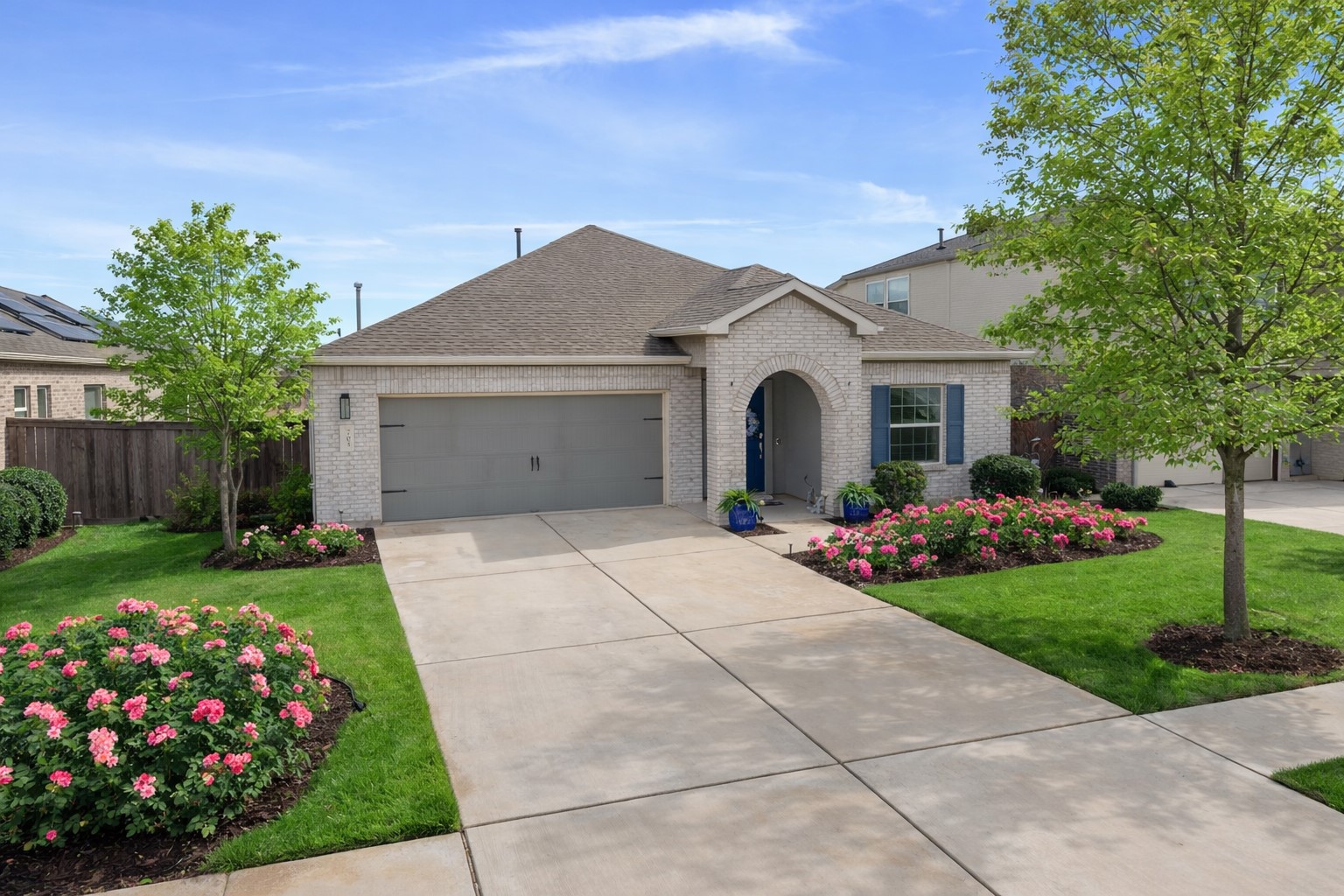 a front view of a house with garden