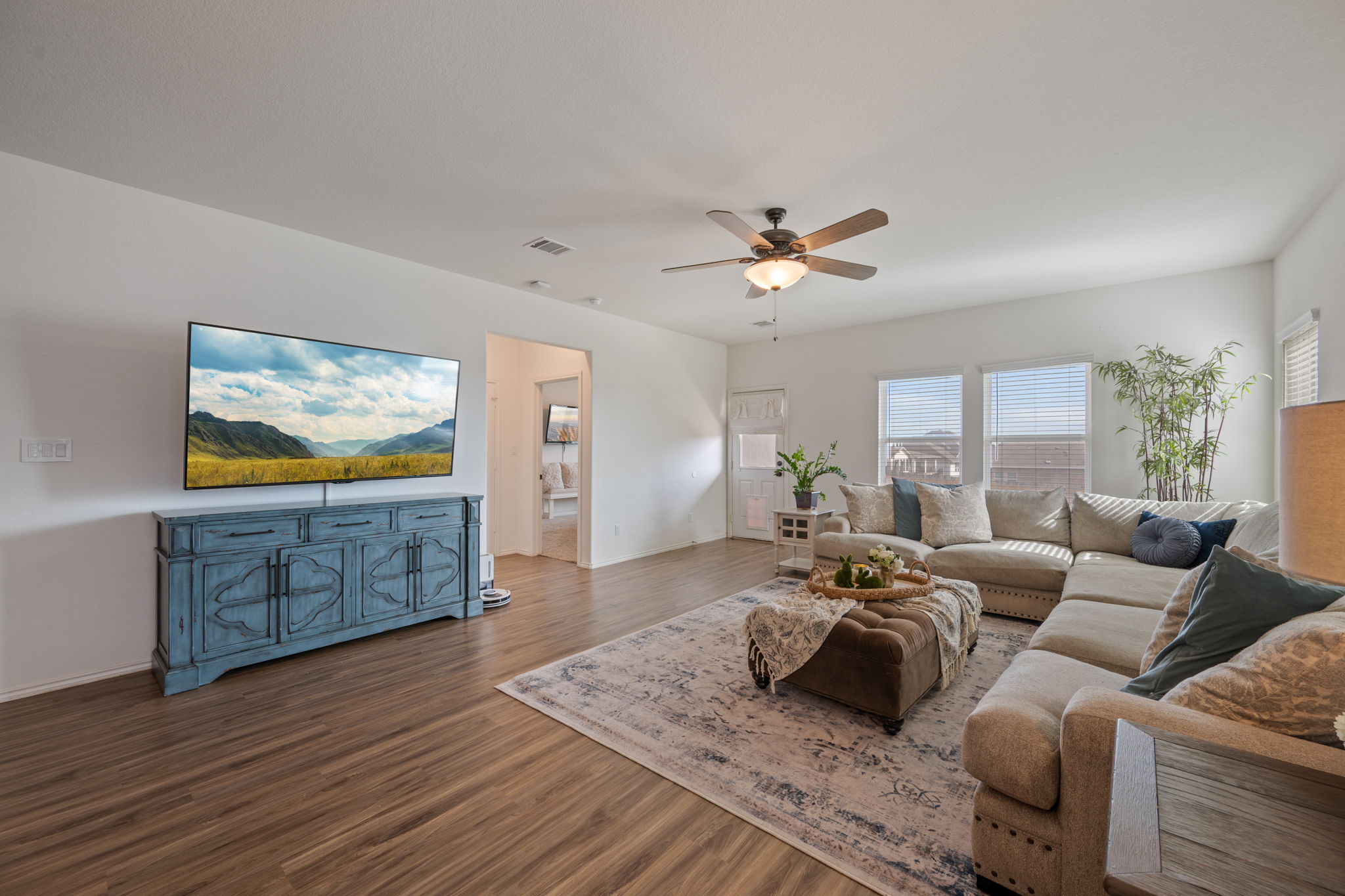 705 Mallow Road Leander, TX 78641 - Photo 11 of 29 a living room with furniture and a flat screen tv
