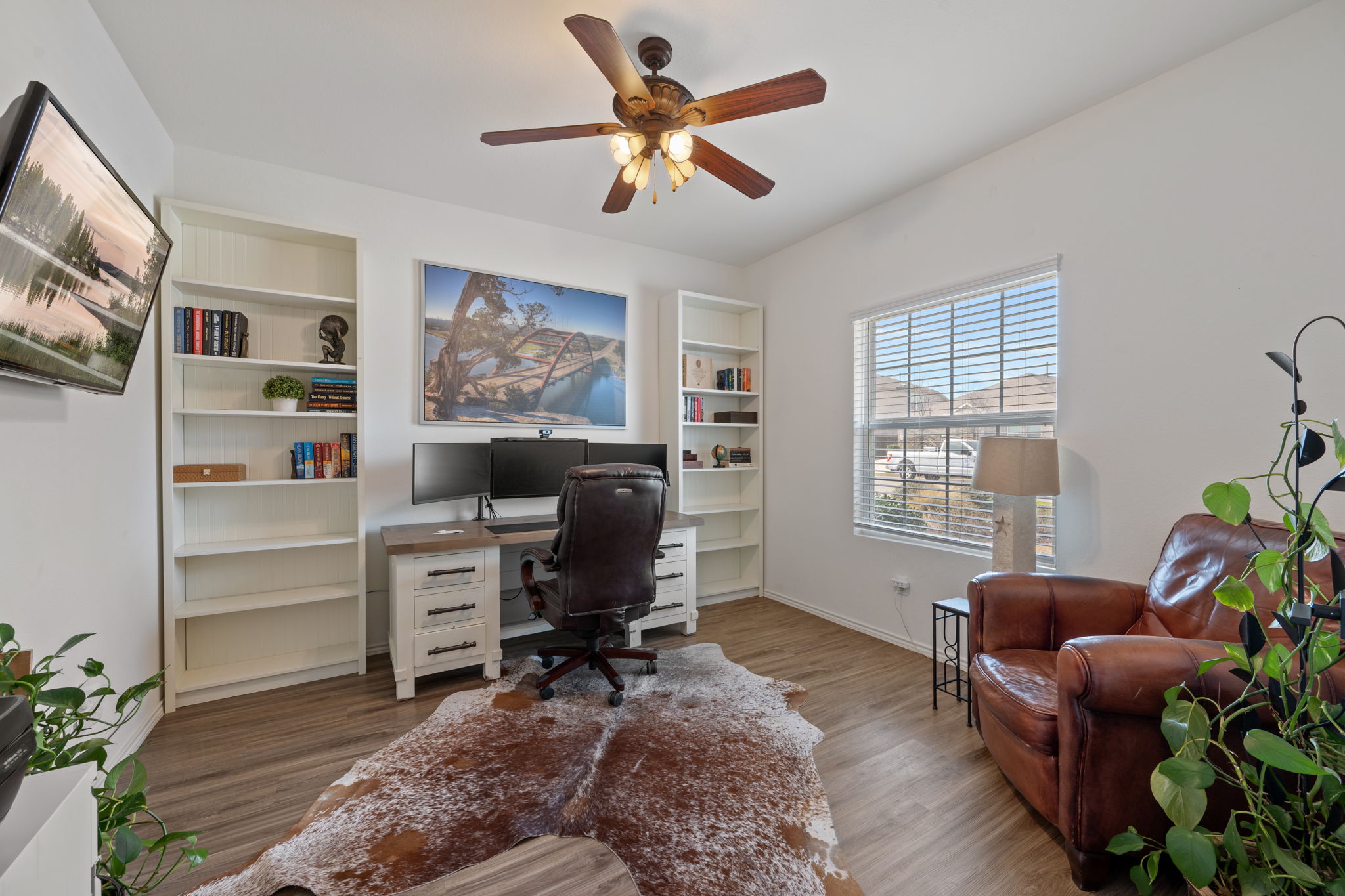 705 Mallow Road Leander, TX 78641 - Photo 18 of 29 a workspace with furniture and a window