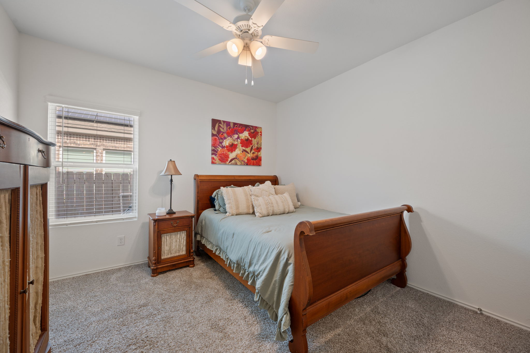 705 Mallow Road Leander, TX 78641 - Photo 19 of 29 a bedroom with a bed and a window