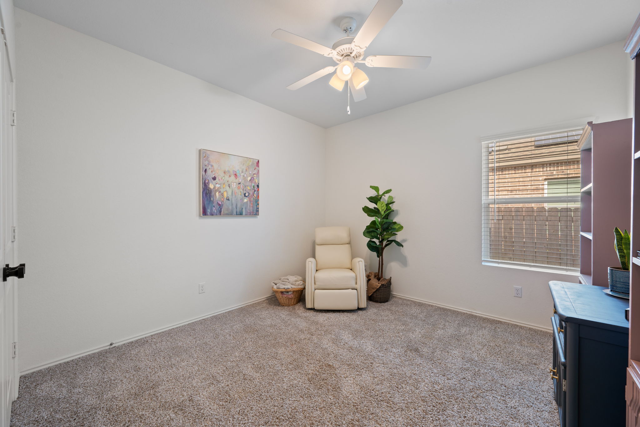 705 Mallow Road Leander, TX 78641 - Photo 21 of 29 an empty room with windows and cabinet