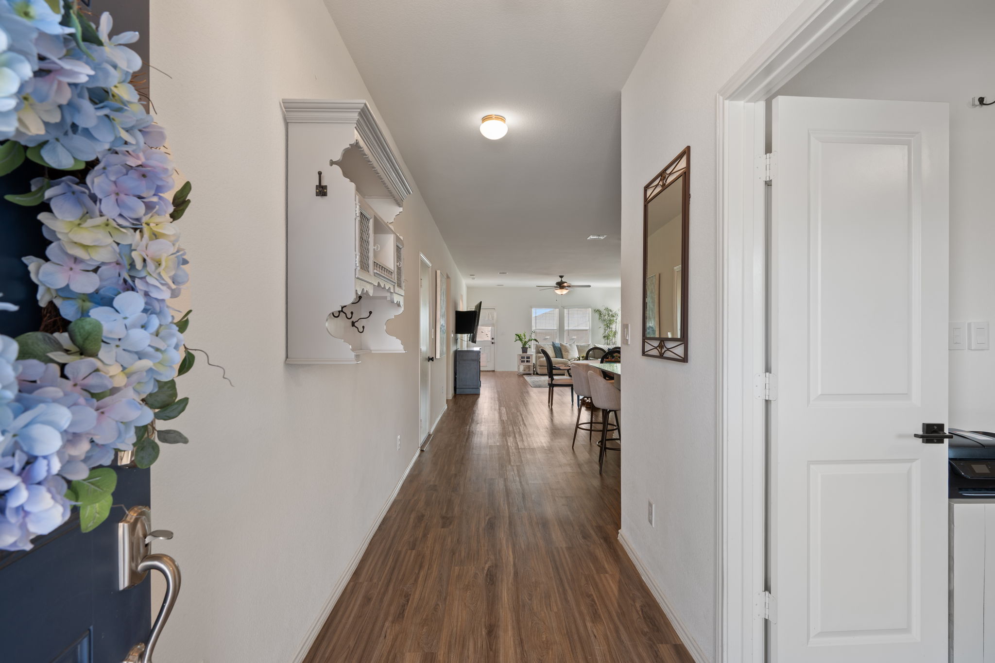 705 Mallow Road Leander, TX 78641 - Photo 5 of 29 a view of a hallway with wooden floor