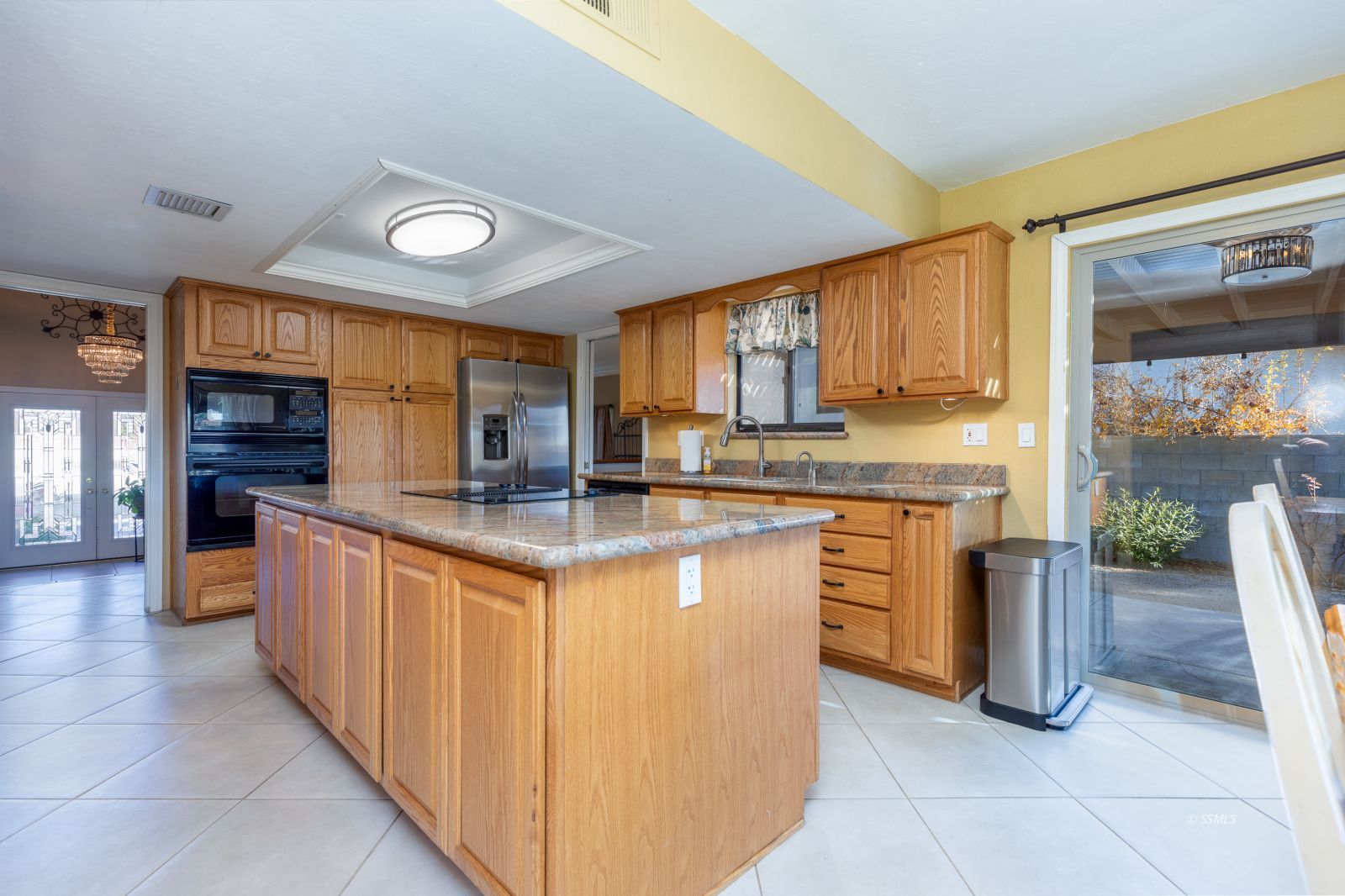 815 Hurschell Avenue Ridgecrest, CA 93555 - Photo 10 of 43 a kitchen with stainless steel appliances granite countertop a stove a sink and a refrigerator
