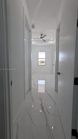 a bathroom with a sink a mirror and shower