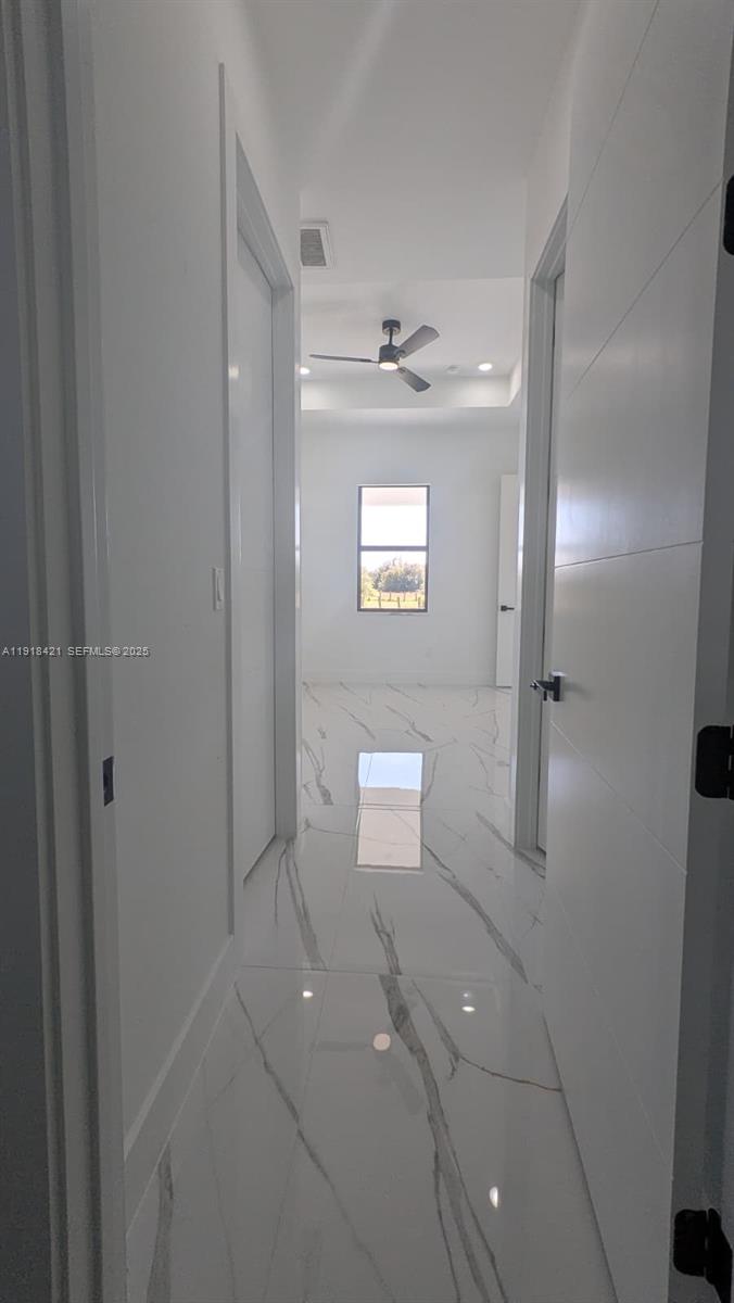 3302 East 18th Street, Unit ST Lehigh Acres, FL 33972 - Photo 20 of 34 a bathroom with a toilet sink and shower
