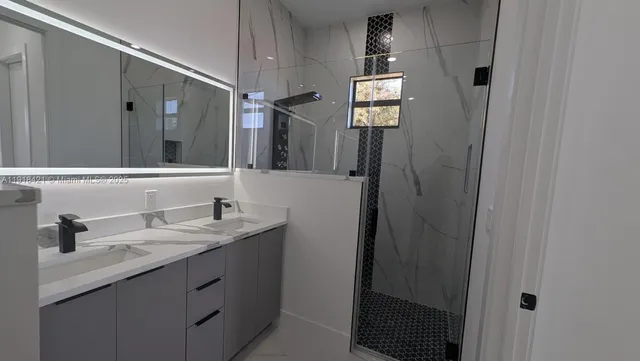a spacious bathroom with a sink a toilet and vanity