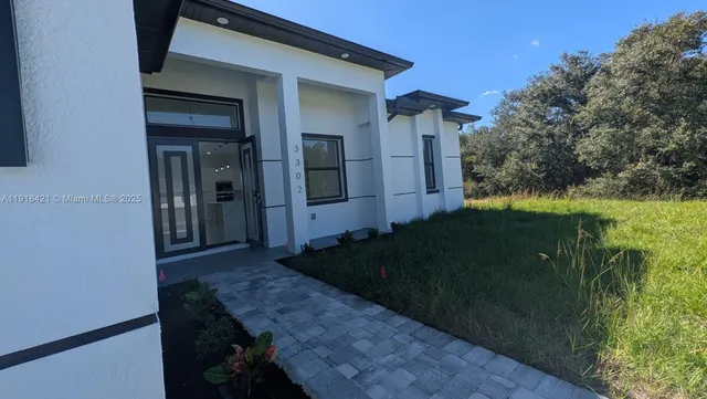 a backyard of a house with lots of green space