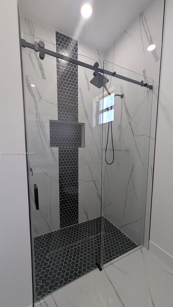 3302 East 18th Street, Unit ST Lehigh Acres, FL 33972 - Photo 31 of 34 a bathroom with a shower