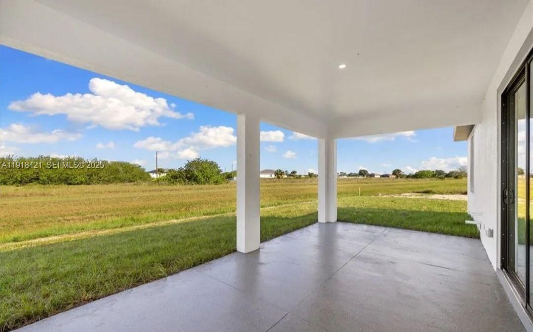 3302 East 18th Street, Unit ST Lehigh Acres, FL 33972 - Photo 33 of 34 a view of an ocean and a building