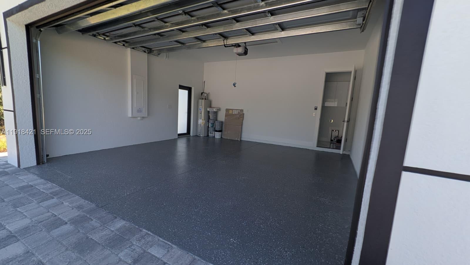 3302 East 18th Street, Unit ST Lehigh Acres, FL 33972 - Photo 5 of 34 a view of a hallway with wooden floor