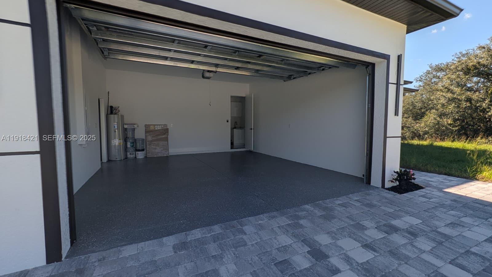 3302 East 18th Street, Unit ST Lehigh Acres, FL 33972 - Photo 6 of 34 a view of a room with staircase and a fireplace